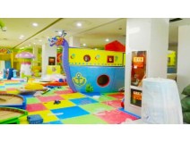 Children have fun at green indoor park Children have fun at green indoor park